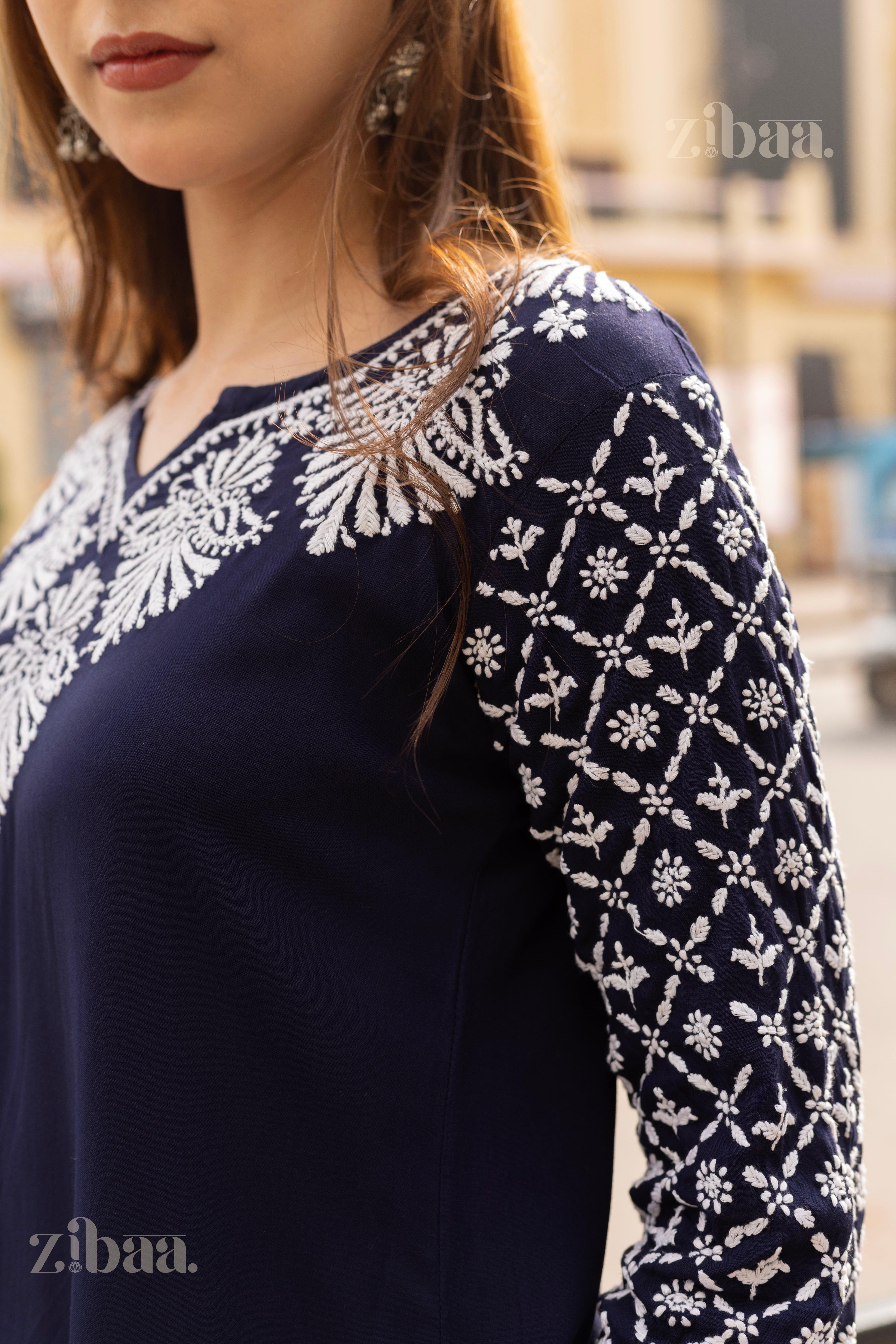 Detailed side view of a Blue Chikankari Kurti showcasing intricate white embroidery on the sleeves and neckline, styled with elegance