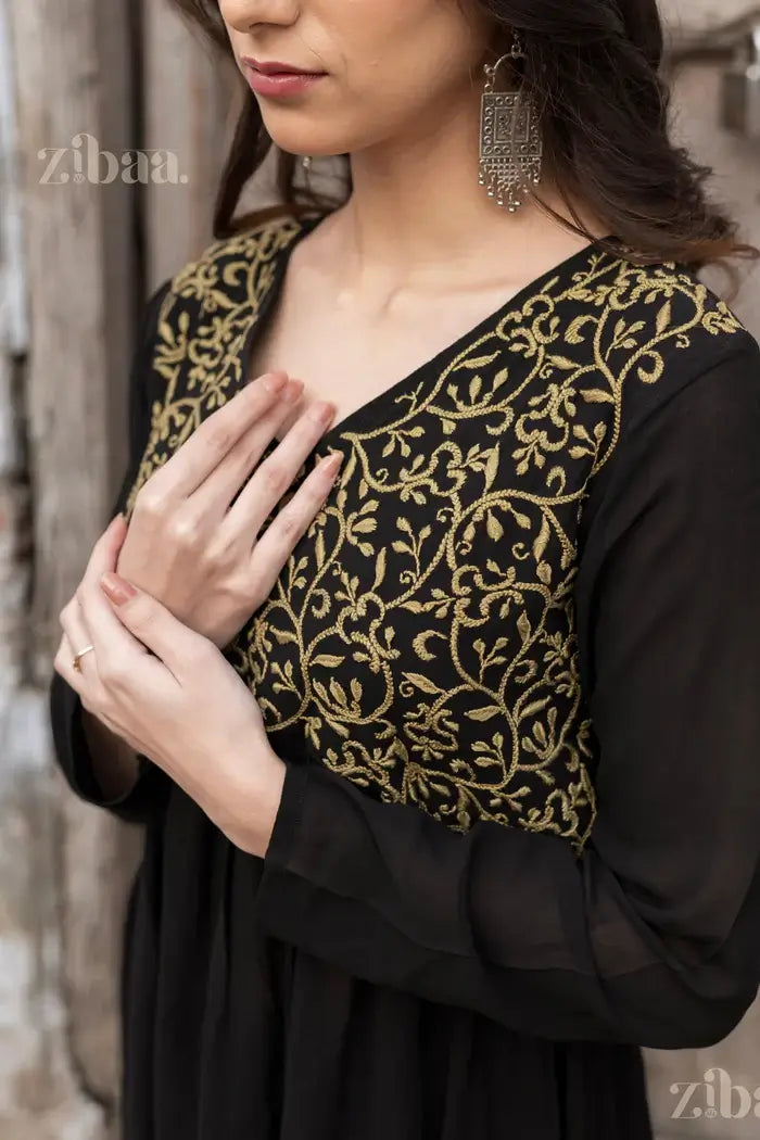 Elegant close-up of a Black Chikankari Kurti featuring intricate gold embroidery, perfect for a sophisticated and traditional look