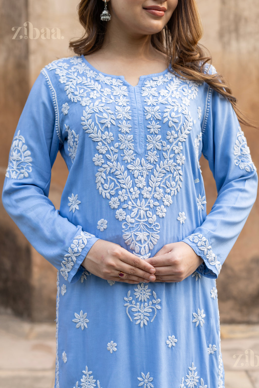 Model in Blue Chikankari Kurta with intricate white embroidery, posing elegantly from front and side angles near a historic monument